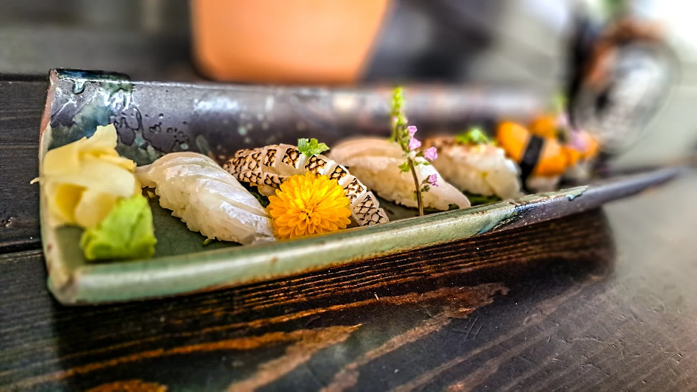 Handcrafted nigiri with fresh garnish