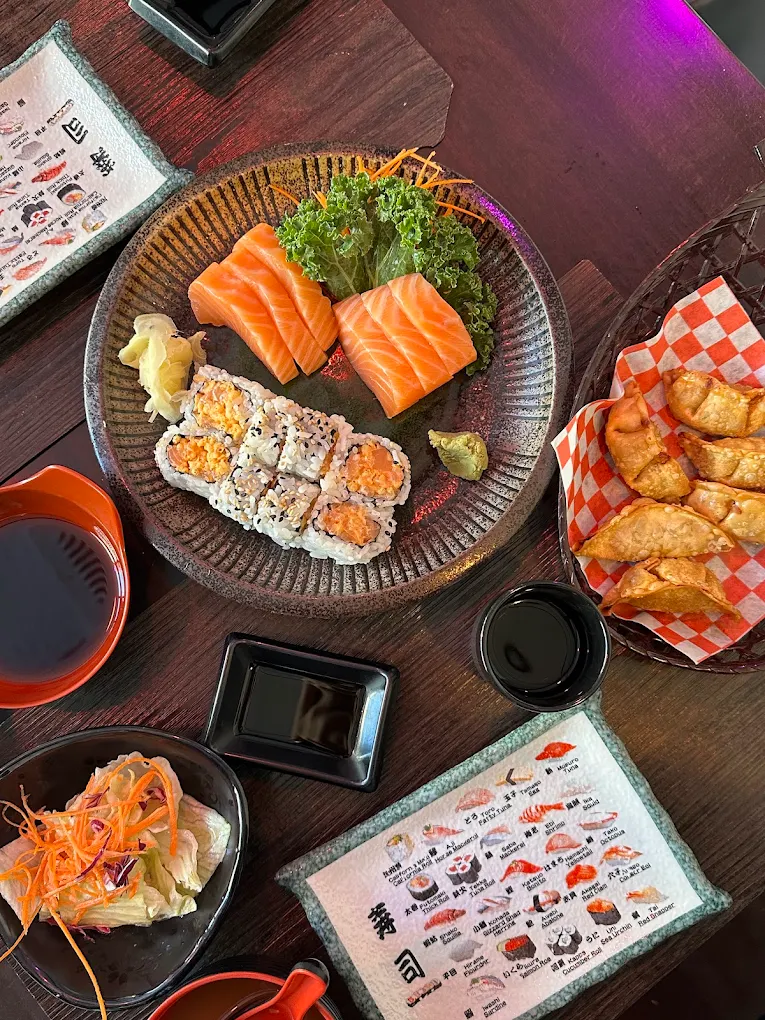 Sashimi, maki rolls and gyoza spread